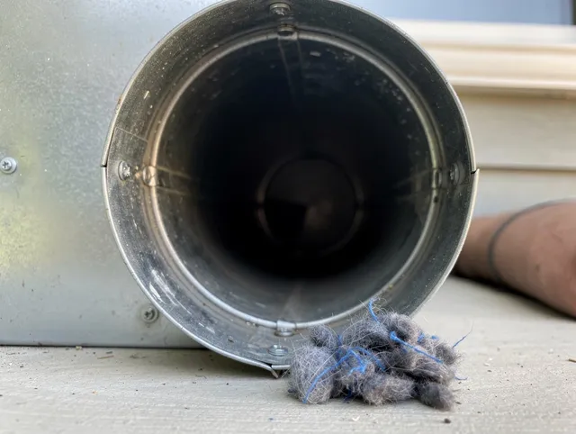 East Haven Dryer Vent Cleaning technician using specialized equipment to clear severe dryer vent blockage in East Haven